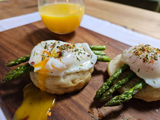 Homemade crumpets with poached egg and asparagus